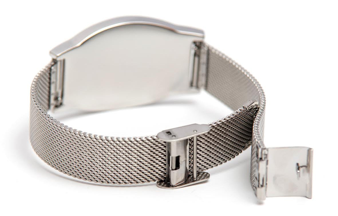 Omega Psi Phi Legacy Bracelet featuring Greek letters ΩΨΦ in royal purple enamel on a brushed silver plaque with a woven silver mesh band.