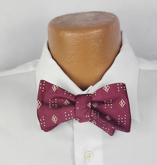 Elevate Your Black Greek Style with the Kappa Founders Floating K Crimson Bowtie from Black Greek Store Featuring Sophisticated Greek Paraphernalia and Jewelry