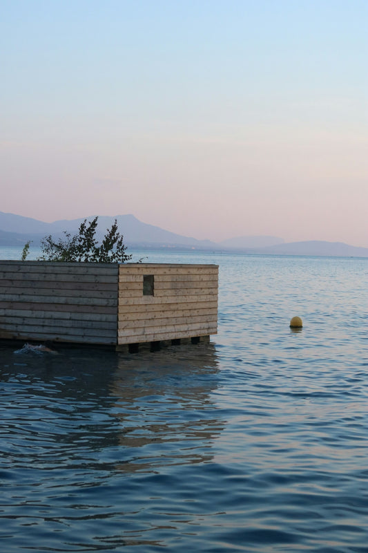 A boat floating on top of a body of water
