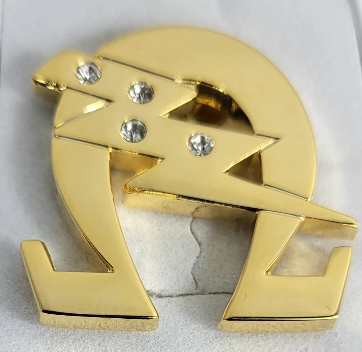 Omega Gold Tone Crystal Lightning Bolt Lapel Pin